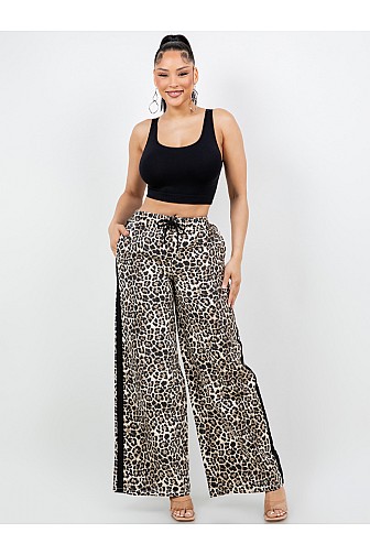 WIDE LEG ANIMAL PRINT PANTS WITH DRAWSTRING WAIST.